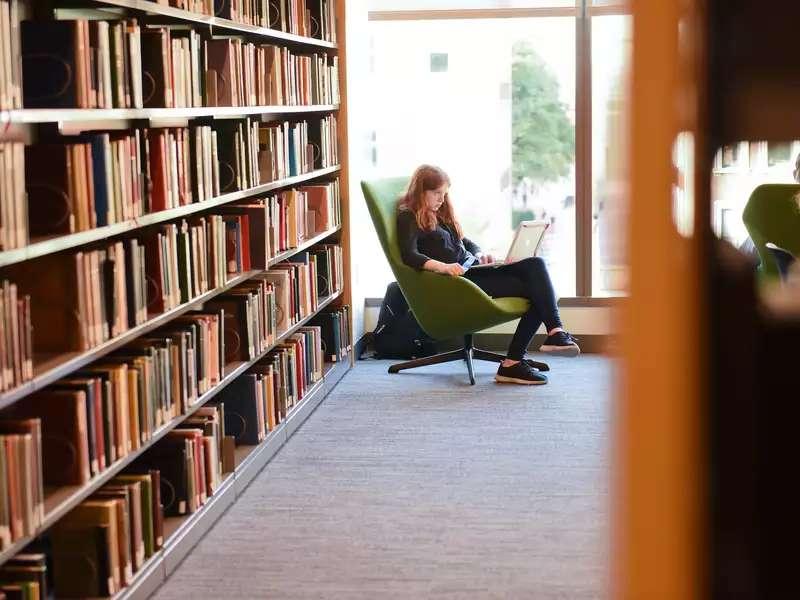 Student reading in the library